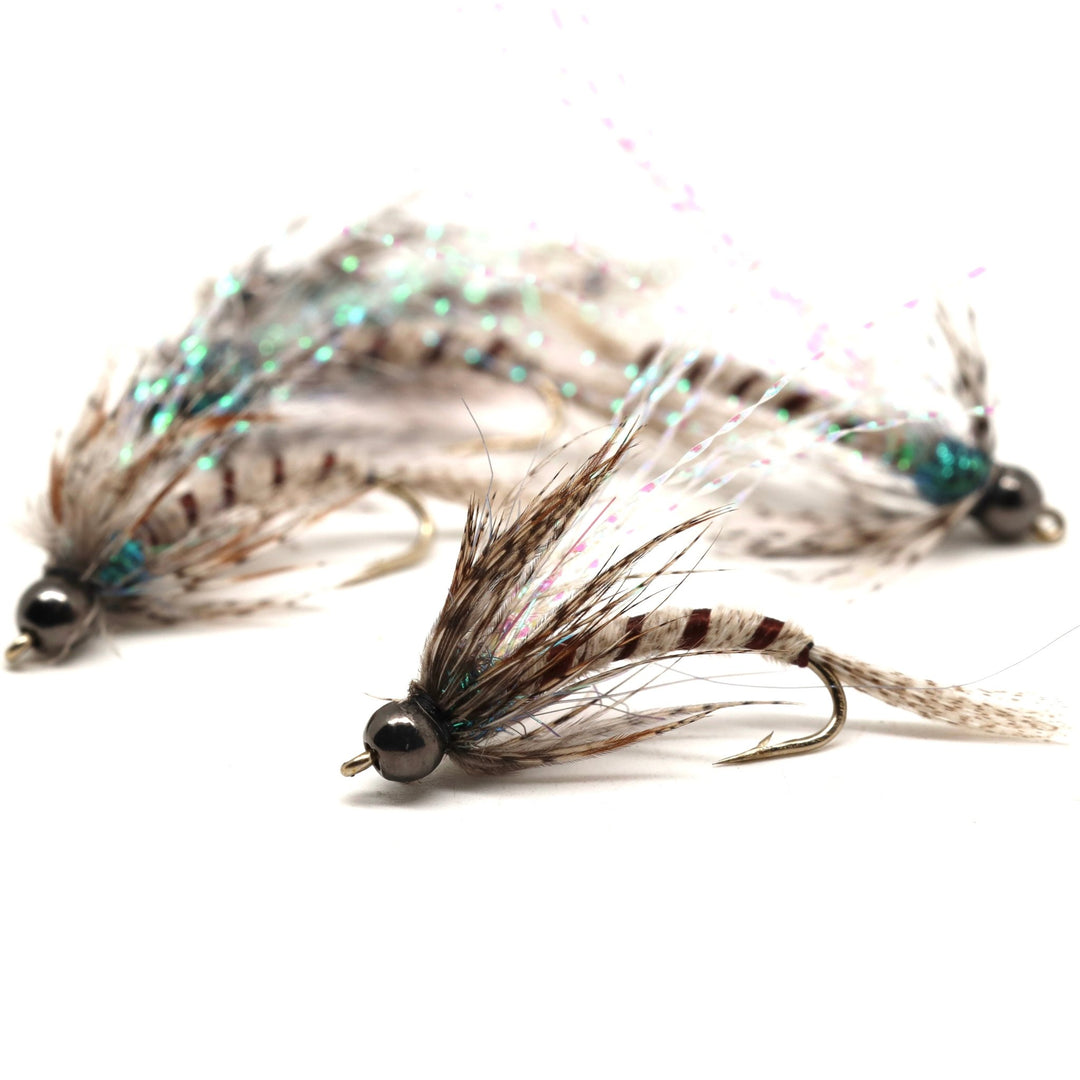Slate Drake Bugger streamer fly with dark slate body, buggy hackle, and marabou tail for imitating large mayfly nymphs, leeches, and baitfish in trout streams.
